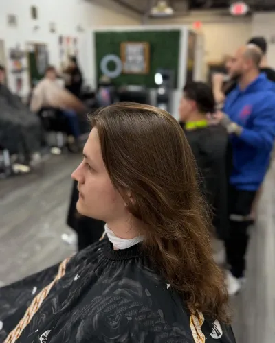 Client with long, shoulder-length hair before the cut